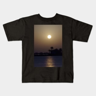 Sunset at palm beach Kids T-Shirt